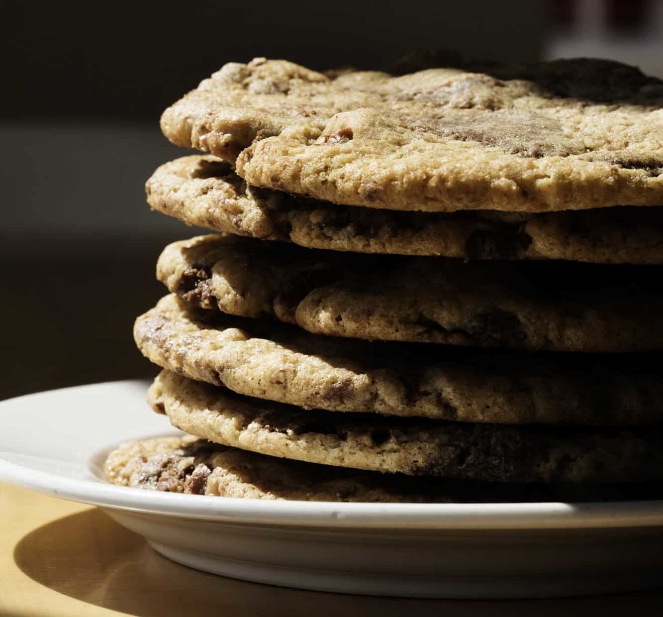 A stack of warm chocolate chip cookies from yum! Kitchen and Bakery