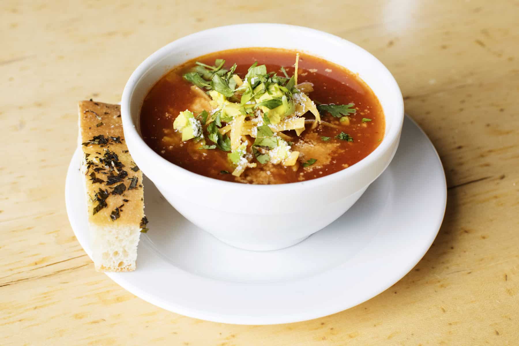 A bowl of tortilla soup from yum! Kitchen and Bakery