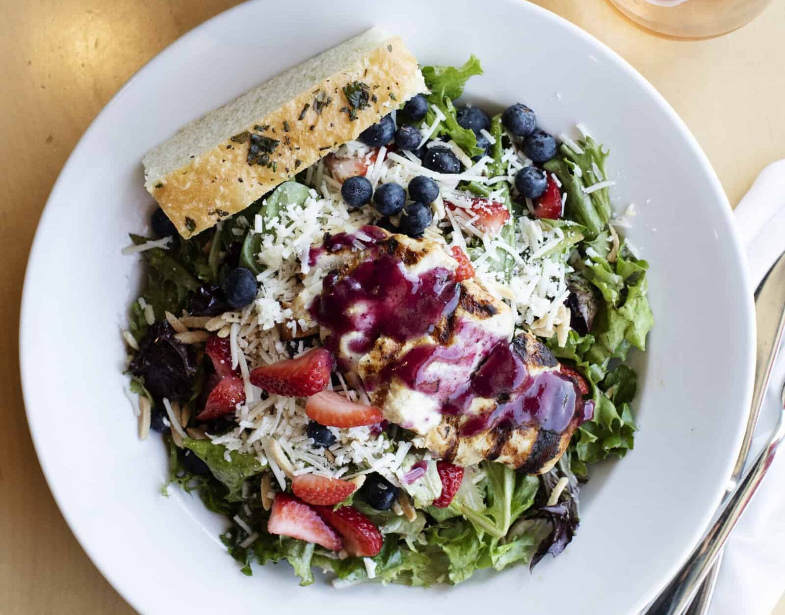 yum! blueberry salad paired with a glass of rosé from yum! Kitchen and Bakery